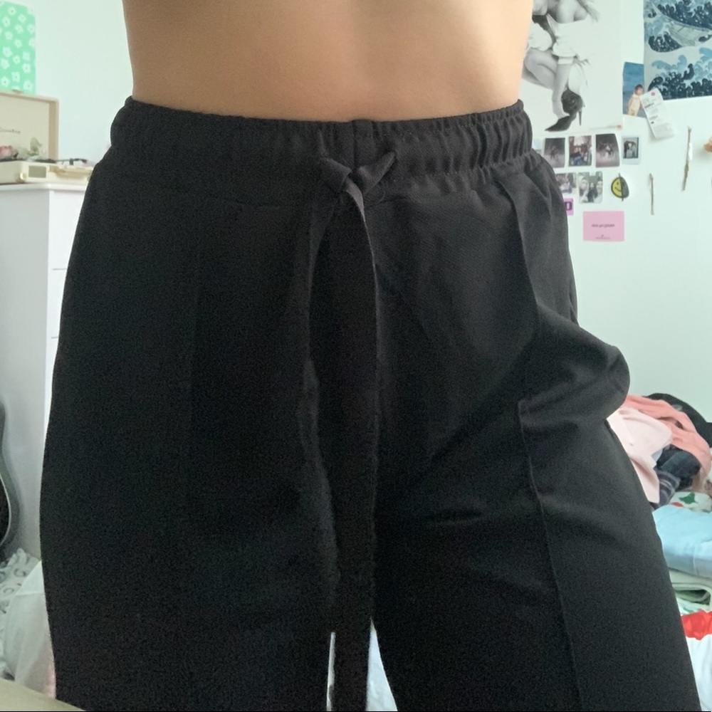 Soft plazo pants with ties at waist.